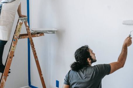 Room Makeovers - A Couple Painting The Wall