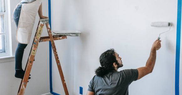 Room Makeovers - A Couple Painting The Wall