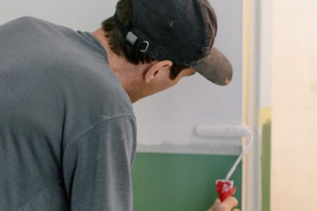 DIY Projects - Man painting walls in new apartment