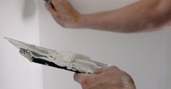 DIY Projects - Crop man working with putty at home
