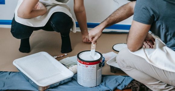 Room Makeovers - Man Mixing Paint In A Can