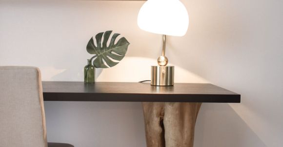 Furniture - Stainless Steel Base White Shade Table Lamp on Brown Wooden Desk Near White Painted Wall With Wall Mounted Flat Screen T V