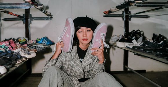Storage Solutions - Eccentric woman with shoes in wardrobe
