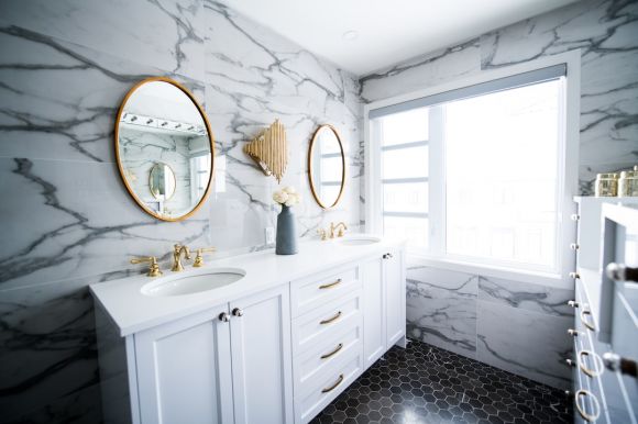 Bathroom Makeover - a bathroom with two sinks and a large mirror