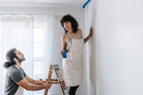 Room Makeovers - Couple Painting The Wall