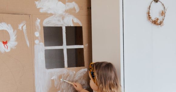 Renovation Tips - Girl Painting Cardboard House