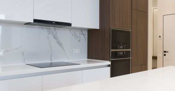 Kitchen Renovation - White and wooden furniture in modern kitchen with contemporary appliances