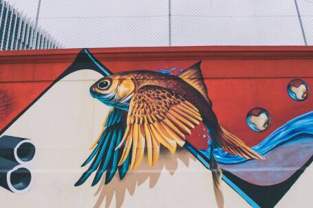 Wall Painting - Photo of Brown, Blue, Red, and White Fish With Wings Wall Painting