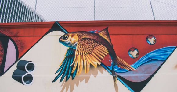 Wall Painting - Photo of Brown, Blue, Red, and White Fish With Wings Wall Painting
