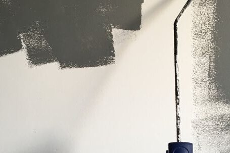 Wall Painting - Person Holding Paint Roller While Painting the Wall